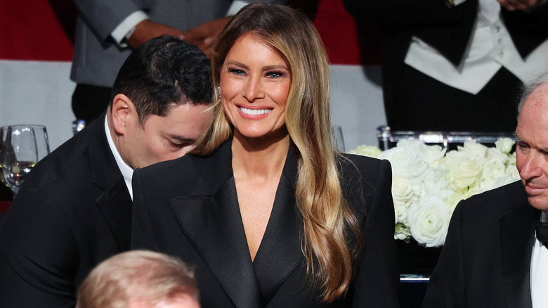 Melania Trump smiling at an event.