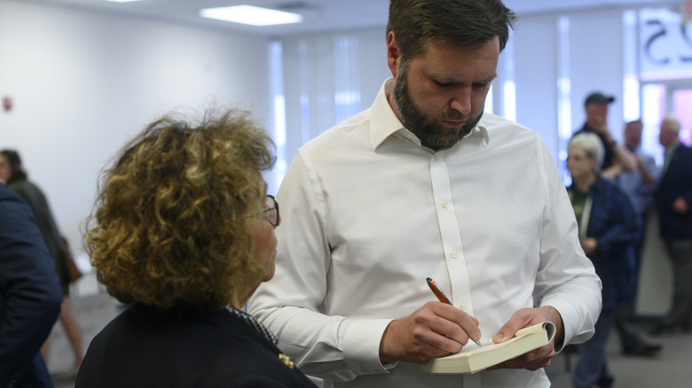 JD Vance signing his book for a supporter