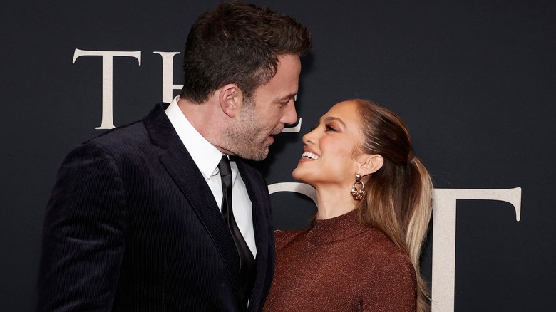 Ben affleck smiling down at jennifer lopez 