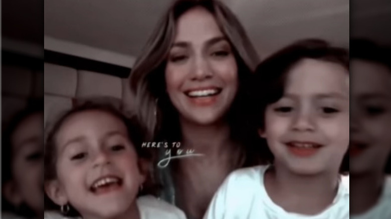 Jennifer Lopez smiling with her twin children