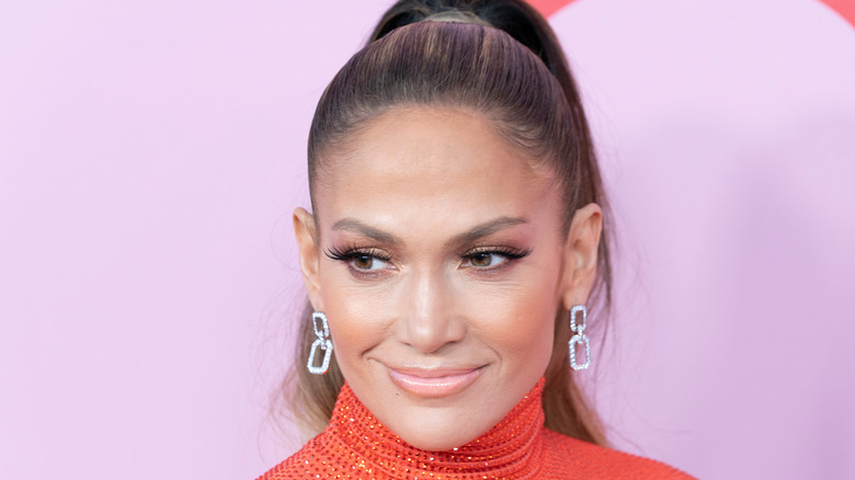 jennifer lopez ponytail orange turtleneck