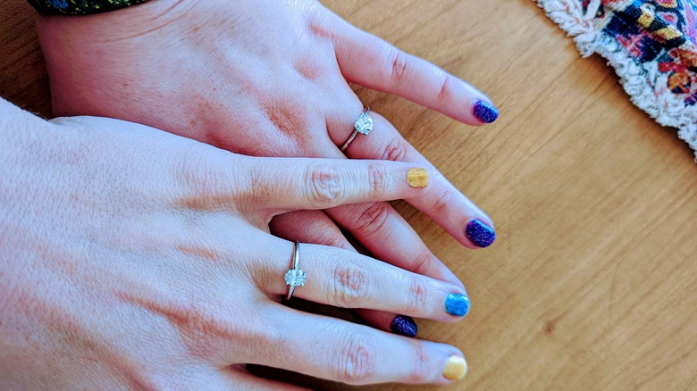 Amy Schneider and fiance Genevieve Davis' hands