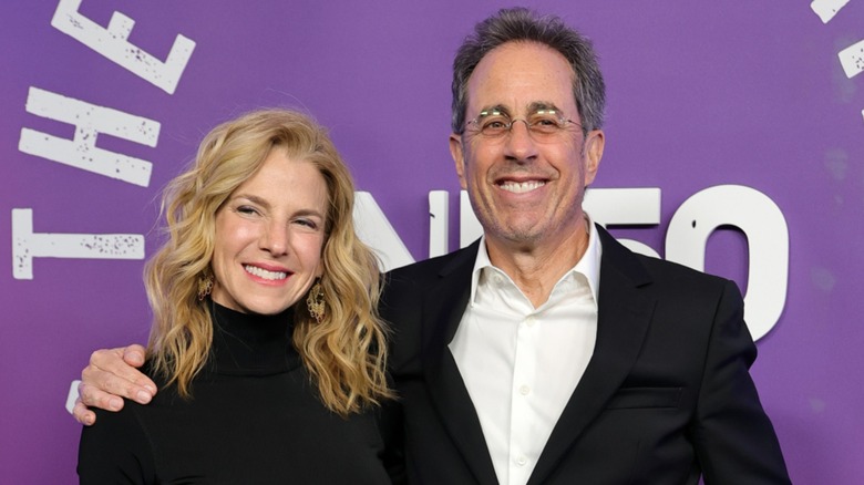 Jerry Seinfeld and Jessica Seinfeld posing and smiling together at an event