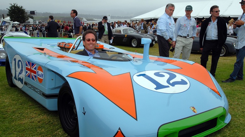 Jerry Seinfeld sitting in his Porsche 917