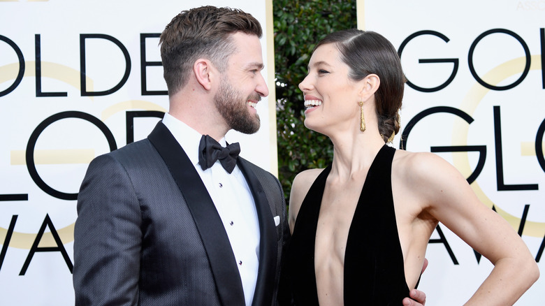 Jessica Biel and Justin Timberlake smiling at each other