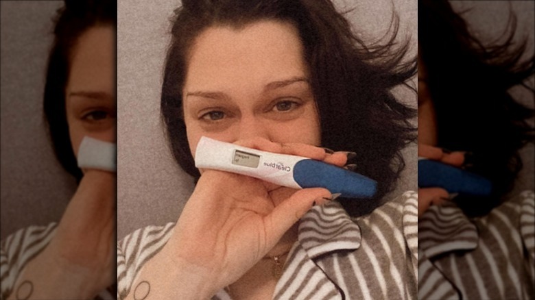 Jessie J holding a pregnancy test