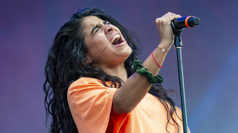 Jessie Reyez performing onstage