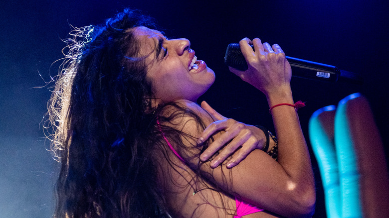 Jessie Reyez sings onstage