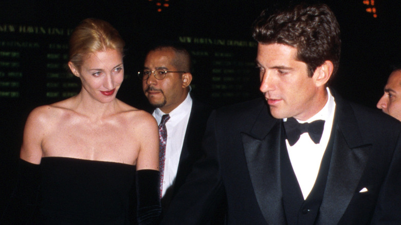 JFK Jr. and Carolyn Besette walking