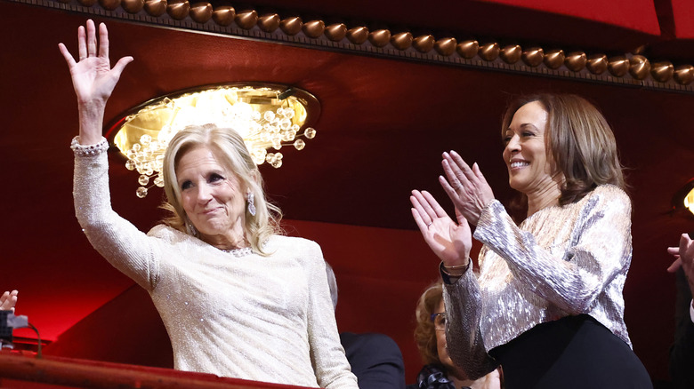 Jill Biden waving at crowd next to Kamala Harris