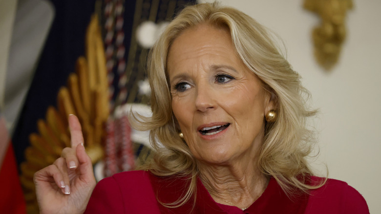 Jill Biden wearing red, pointing her finger