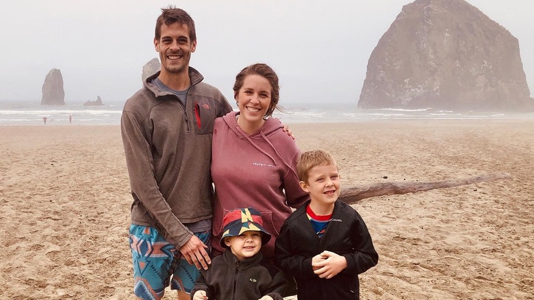 Jill Duggar, Derrick Dillard, and their sons smiling