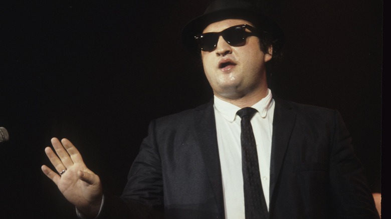 John Belushi performing in "The Blues Brothers"