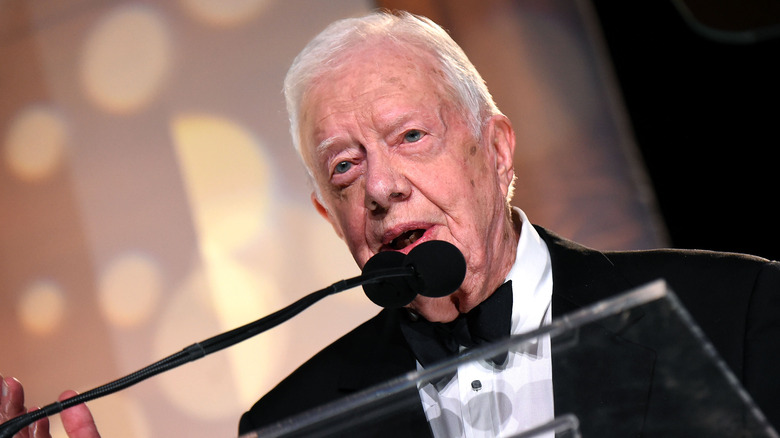 Jimmy Carter speaking at microphone