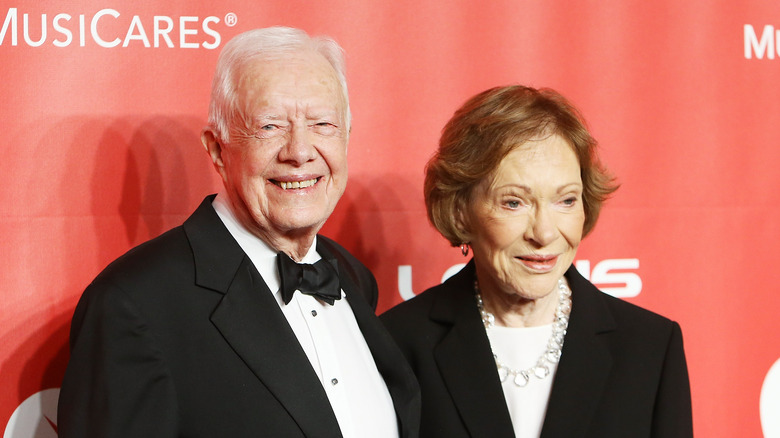 Jimmy and Rosalynn Carter pose on the red carpet