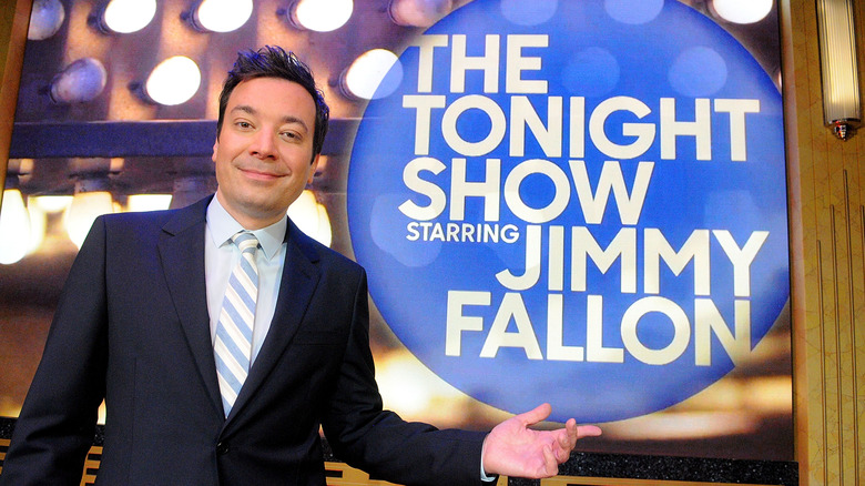 Jimmy Fallon posing with talk show sign
