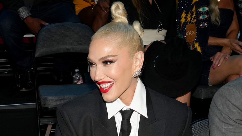 Gwen Stefani beaming with updo