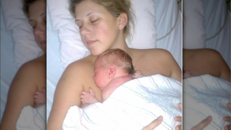 Jodie Sweetin holding daughter Beatrix