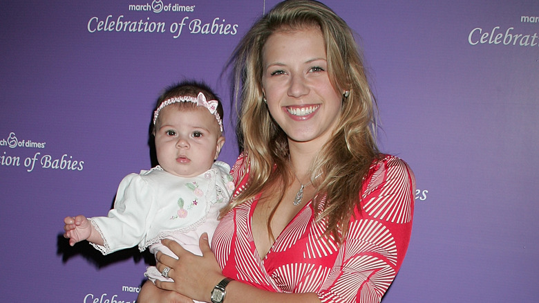 Jodie Sweetin holding daughter Zoie