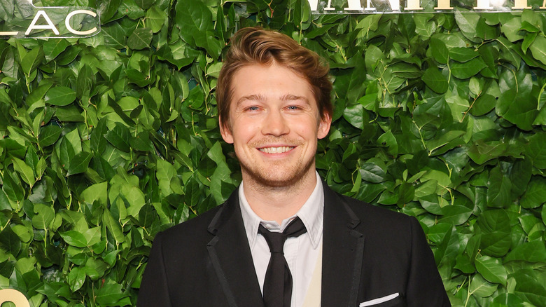 Joe Alwyn black suit