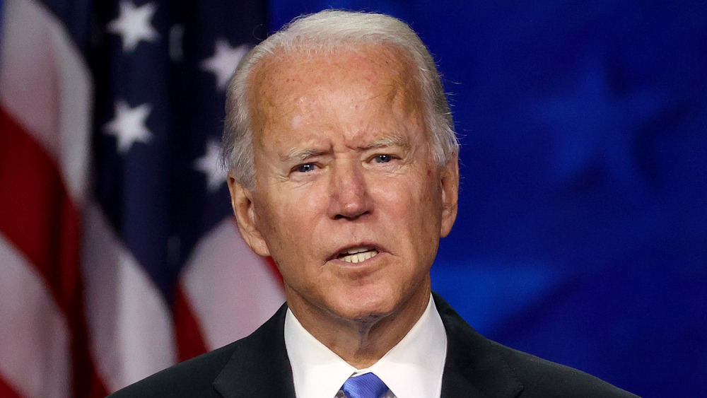 Joe Biden looks animated while speaking at a conference