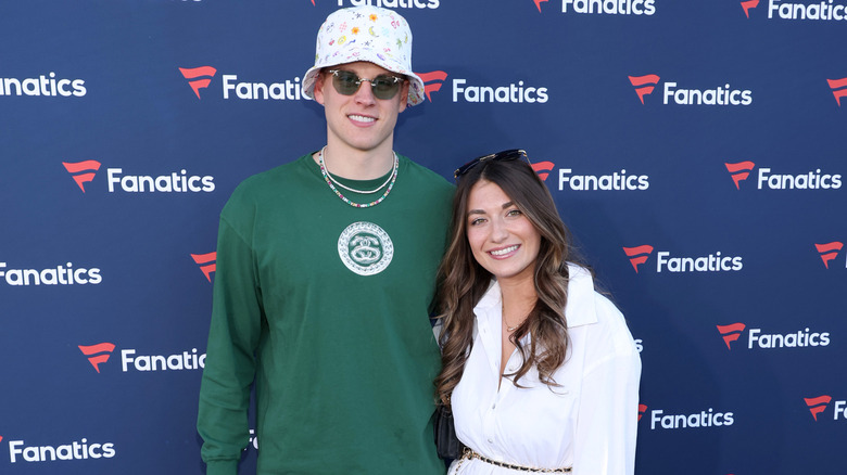 Joe Burrow and Olivia Holzmacher posing