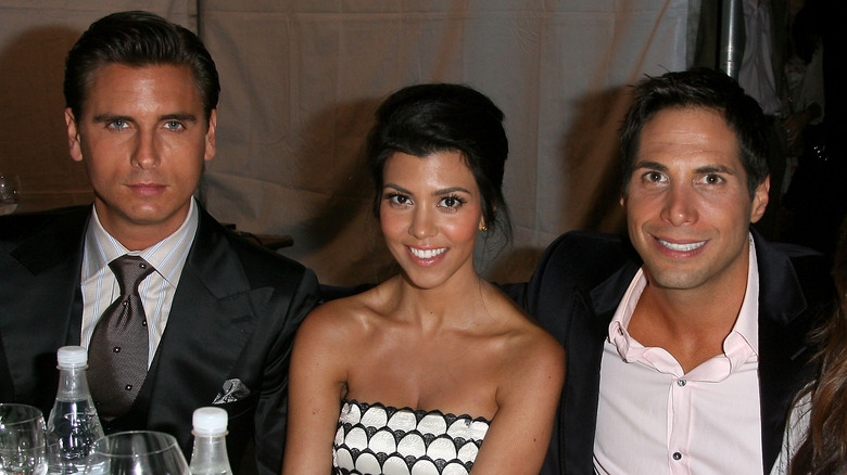 Scott Disick, Kourtney Kardashian, and Joe Francis pose for a photo