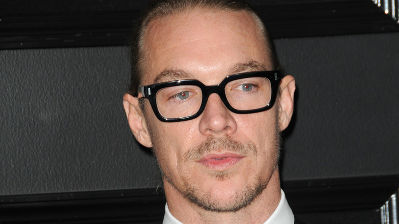 Diplo poses in black-frame glasses