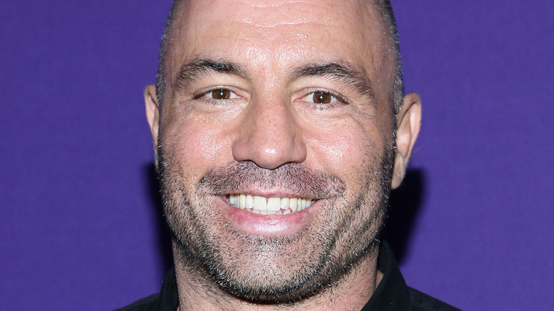 Joe Rogan smiling for cameras in New York City 