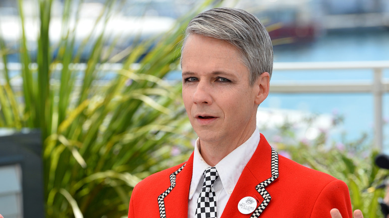 John Cameron Mitchell in a red suit