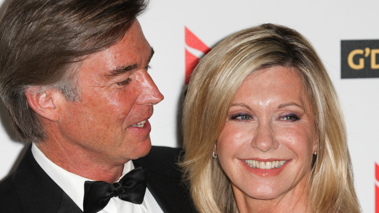 John Easterling looks affectionately at Olivia Newton-John