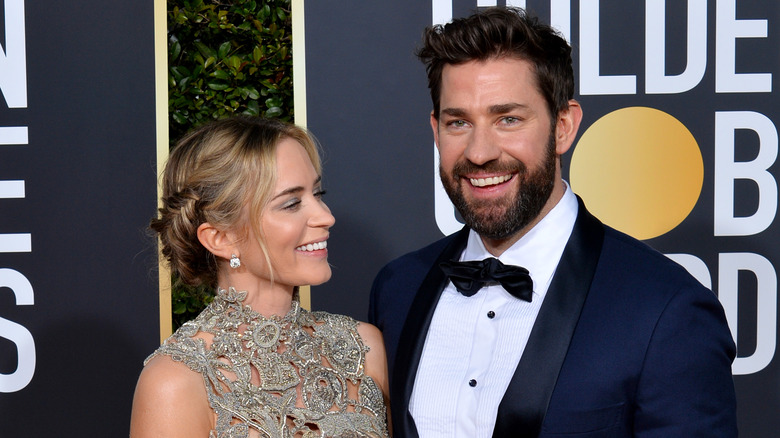 Emily Blunt and John Krasinski laughing on red carpet