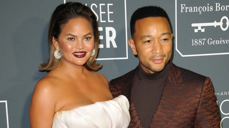 Chrissy Teigen poses with husband John Legend