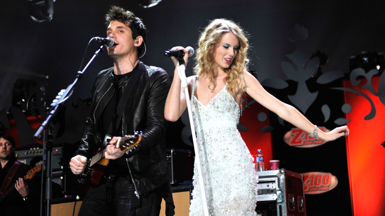 Taylor Swift and John Mayer performing