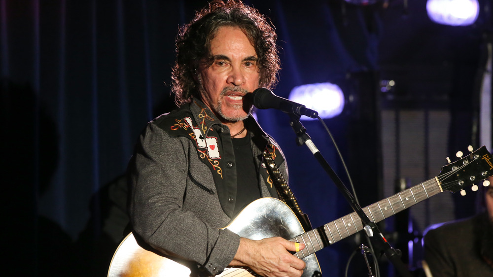 John Oates playing the guitar