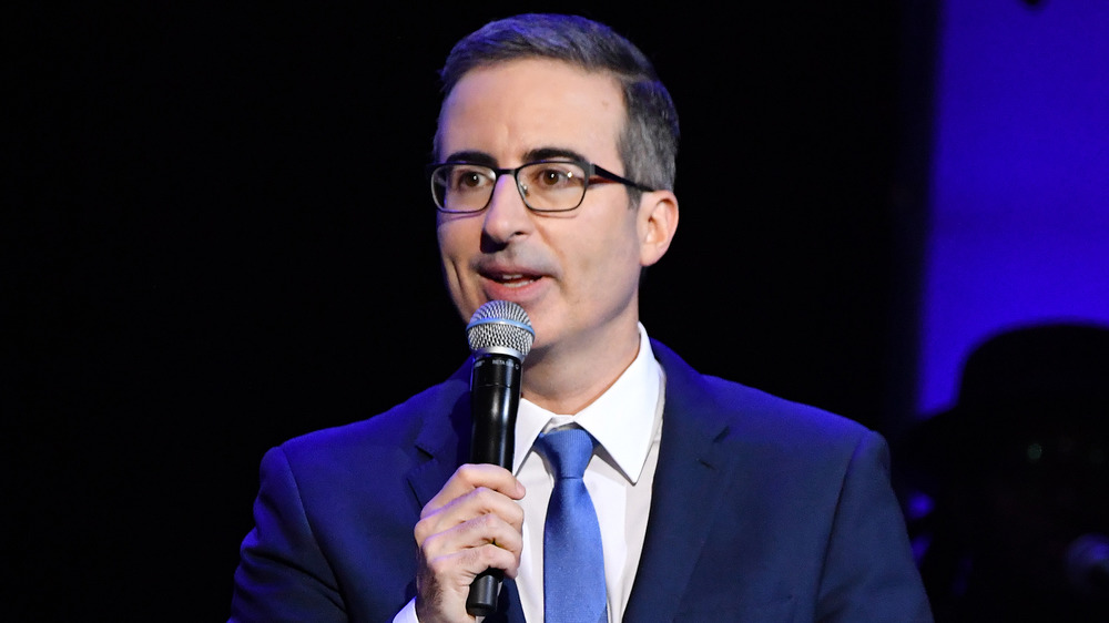 John Oliver speaking in front of an audience