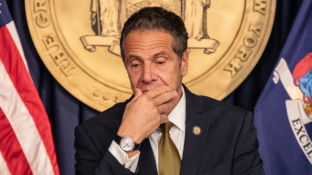 Andrew Cuomo covering his mouth