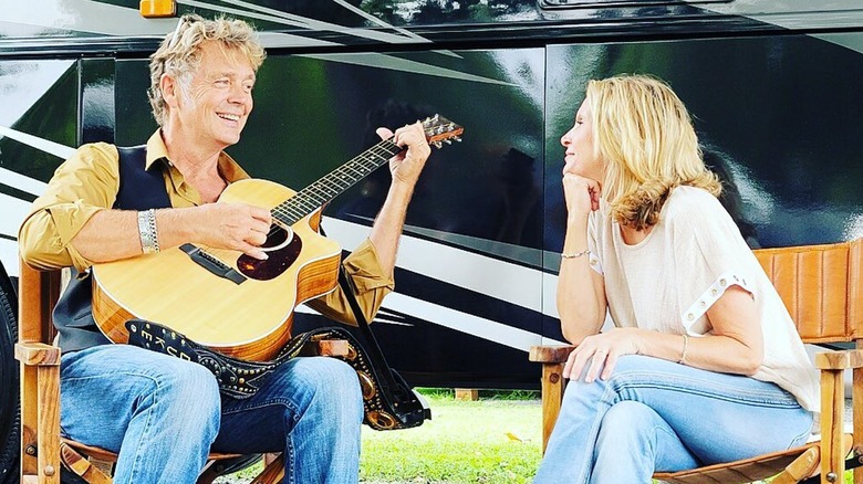 John Schneider playing guitar for Alicia Allain