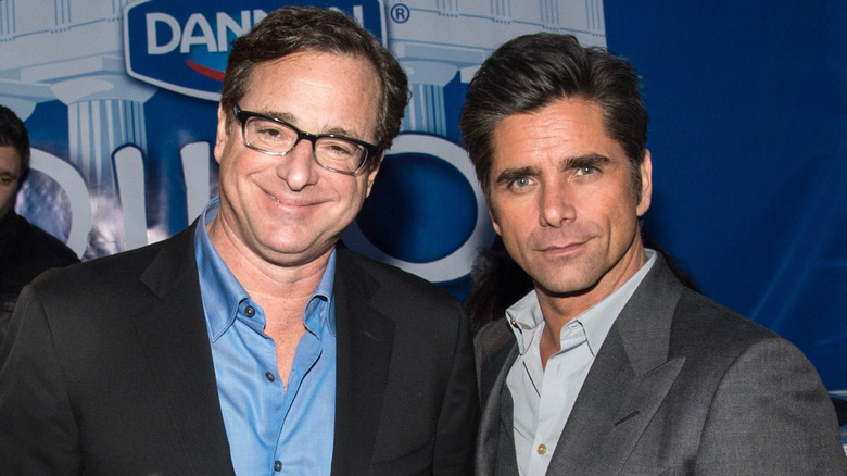 Actors Bob Saget and John Stamos (R) visiting the Dannon Oikos Tent