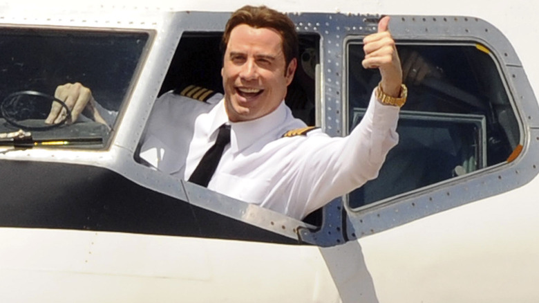 Actor and Qantas Ambassador John Travolta arrives onboard his Boeing 707 aircraft