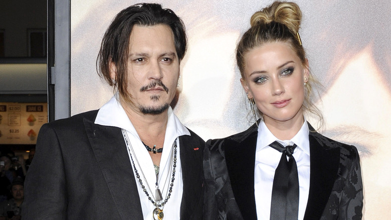 Johnny Depp and Amber Heard posing