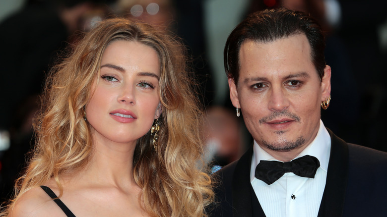 Amber Heard and Johnny Depp posing