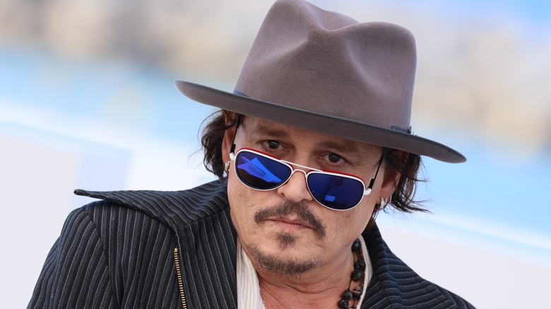 Johnny Depp wearing hat and sunglasses