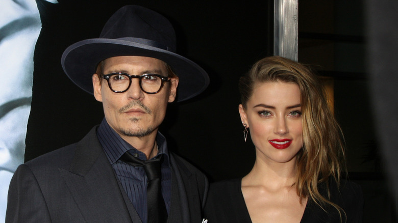 Johnny Depp and Amber Heard smiling