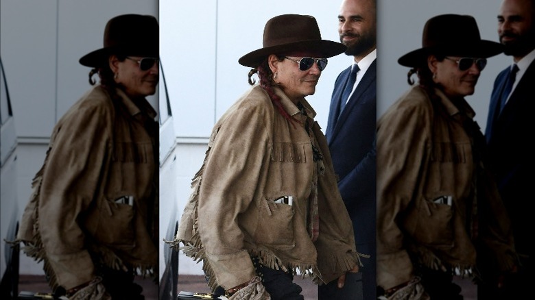 Johnny Depp wearing fedora and aviators