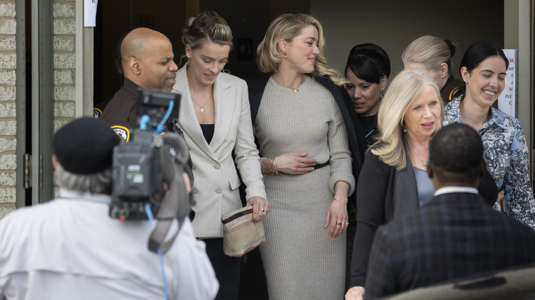 Whitney Henriquez and Amber Heard departing outside court during the Johnny Depp and Amber Heard civil trial