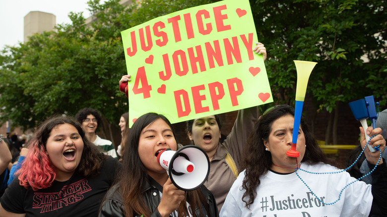 Johnny Depp fans expressing their support of the actor outside court during the Johnny Depp and Amber Heard civil trial