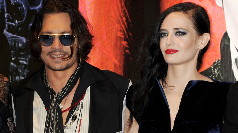 Johnny Depp and Eva Green attend a premiere 