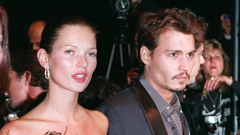 Johnny Depp and Kate Moss at an event 