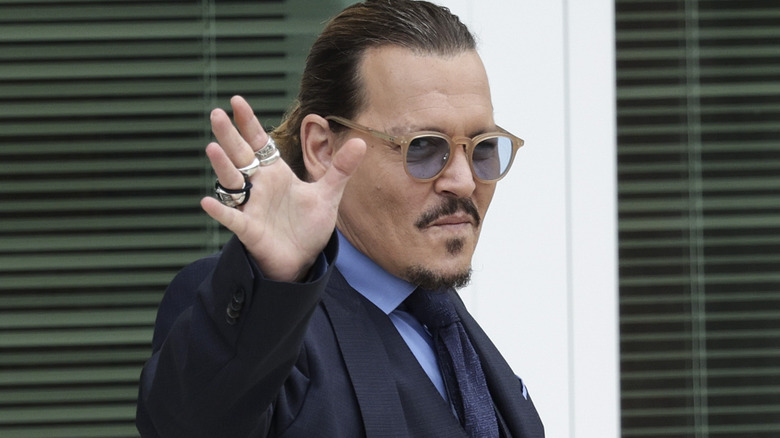 Johnny Depp waves to fans in 2022